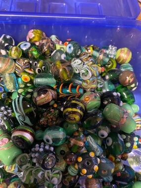 Lamp work green glass bead bag